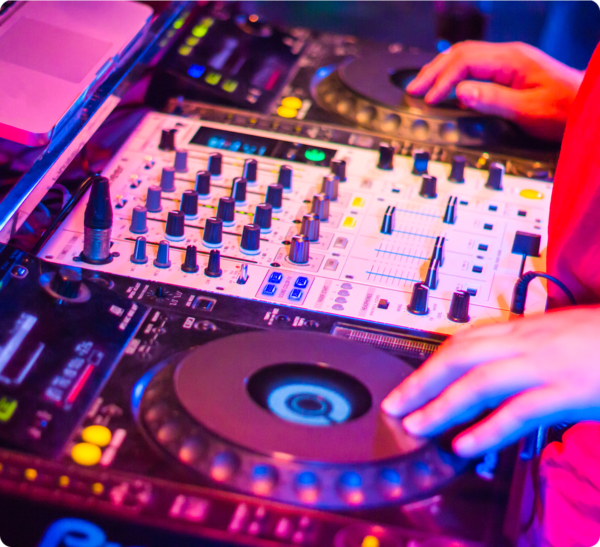 Vibrant nightclub DJ equipment setup