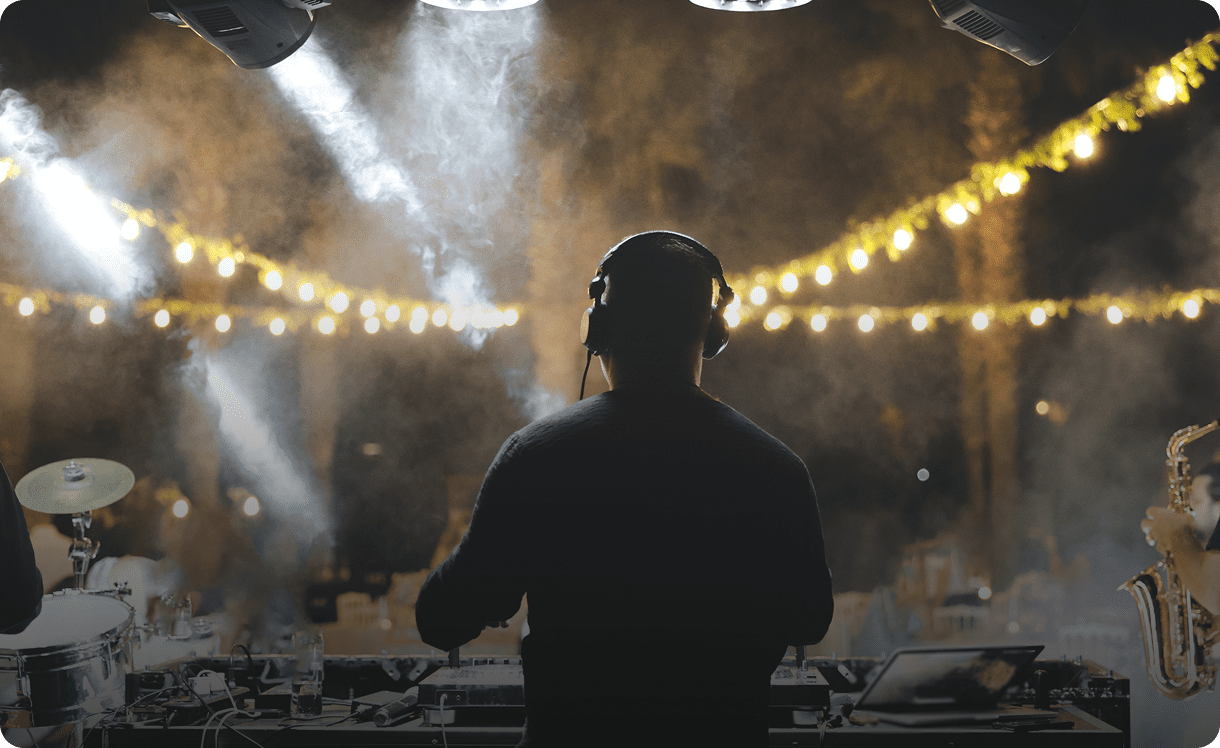 DJ performing at outdoor night event